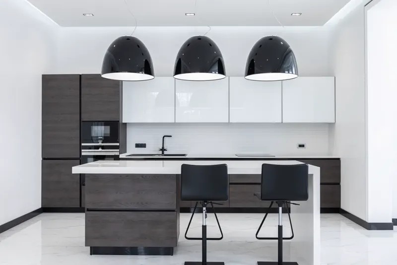 Modern kitchen with quartz-look counters and an island — representative interior, not this specific unit.