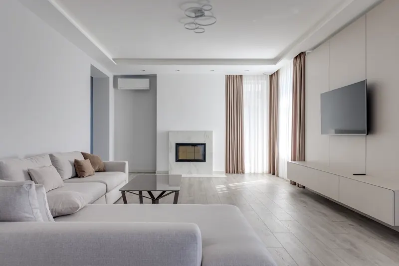 Bright, modern living room with natural light — representative interior, not this specific unit.