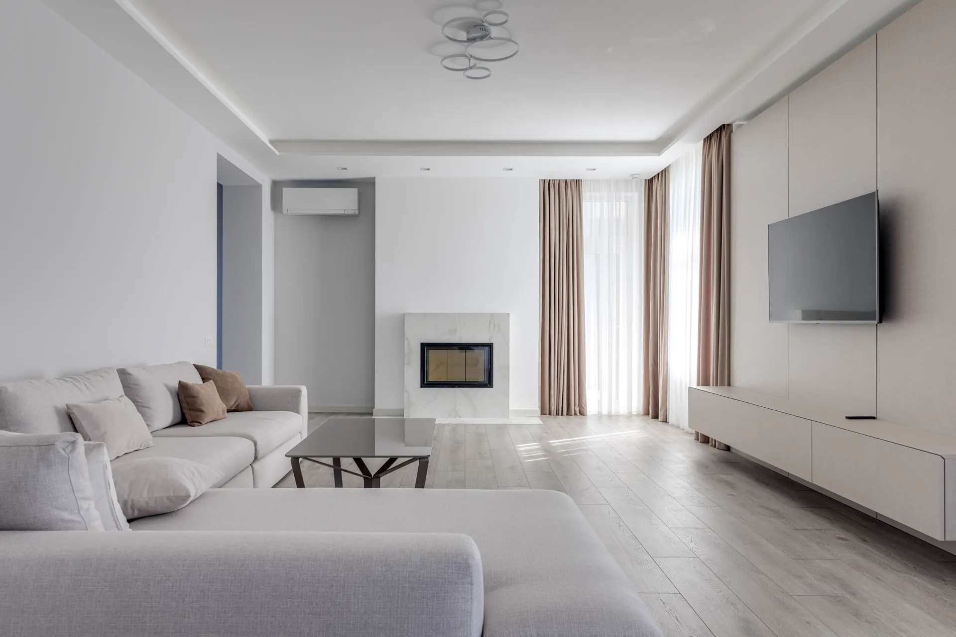 Bright, modern living room with natural light — representative interior.